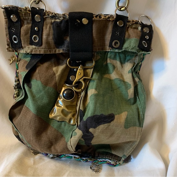 Upcycled Handbags - Camouflage Crossbody Bag with Gold Accents and Image of JK Punkmetal Sculpture.
